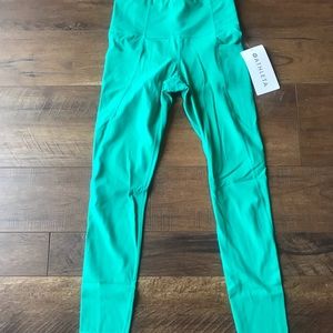 Athleta stash pocket salutation tight